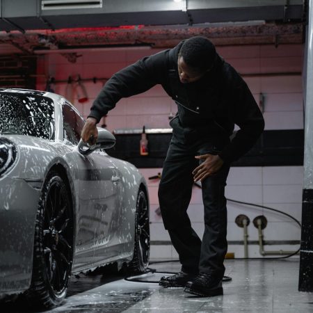 Photo by Tima Miroshnichenko: https://www.pexels.com/photo/man-in-black-jacket-wiping-the-white-car-6873123/